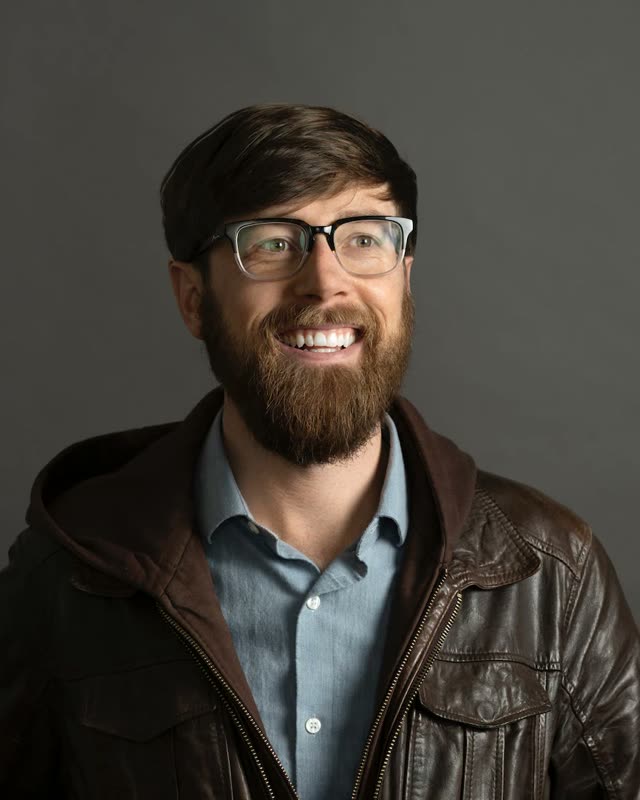 Colton Mulligan headshot: Leather jacket, close up