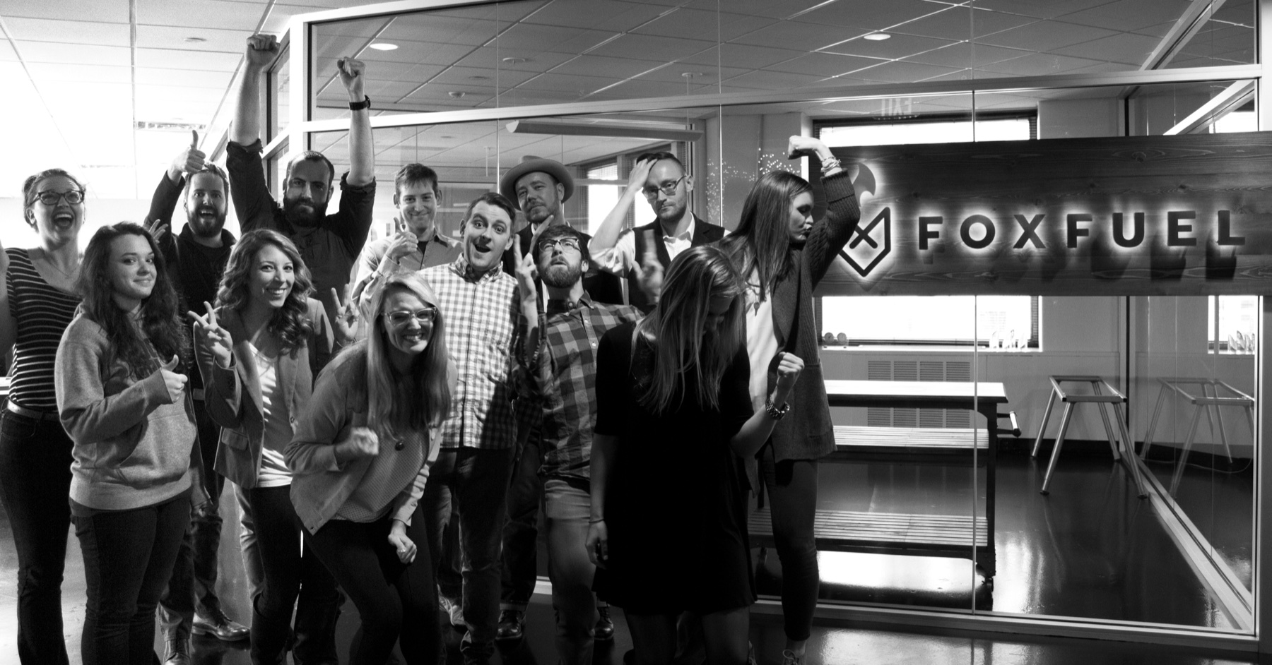 The FoxFuel team being silly in front of the FoxFuel sign, February 2016